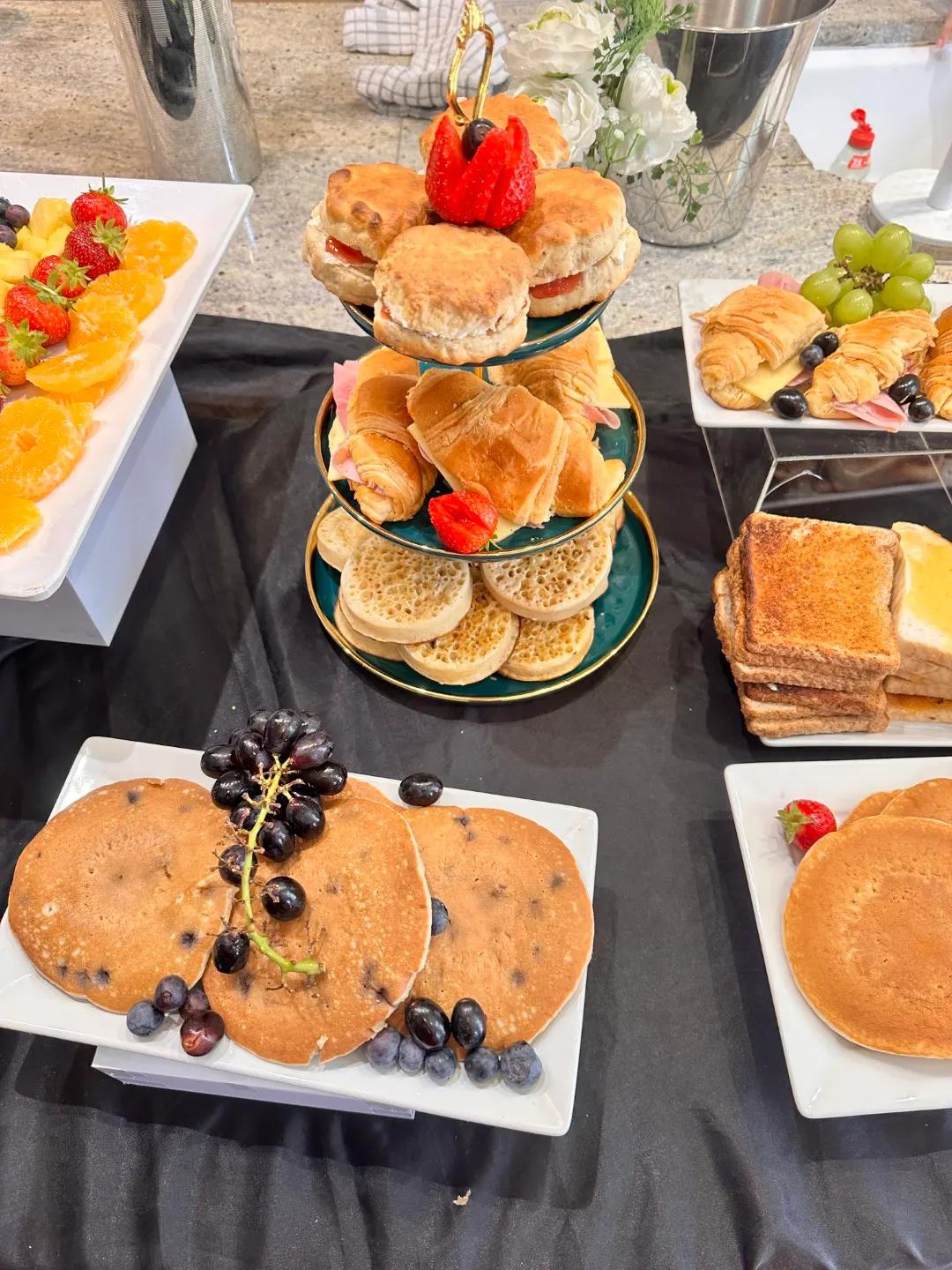 Pancakes, toasties and beans on a brunch table