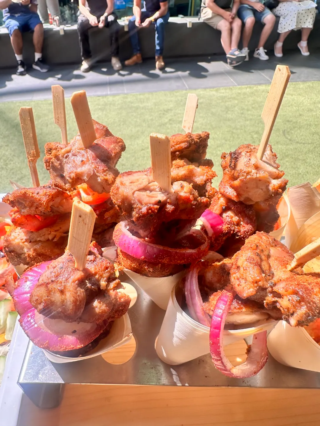 Skewers and fresh salad on the grill station